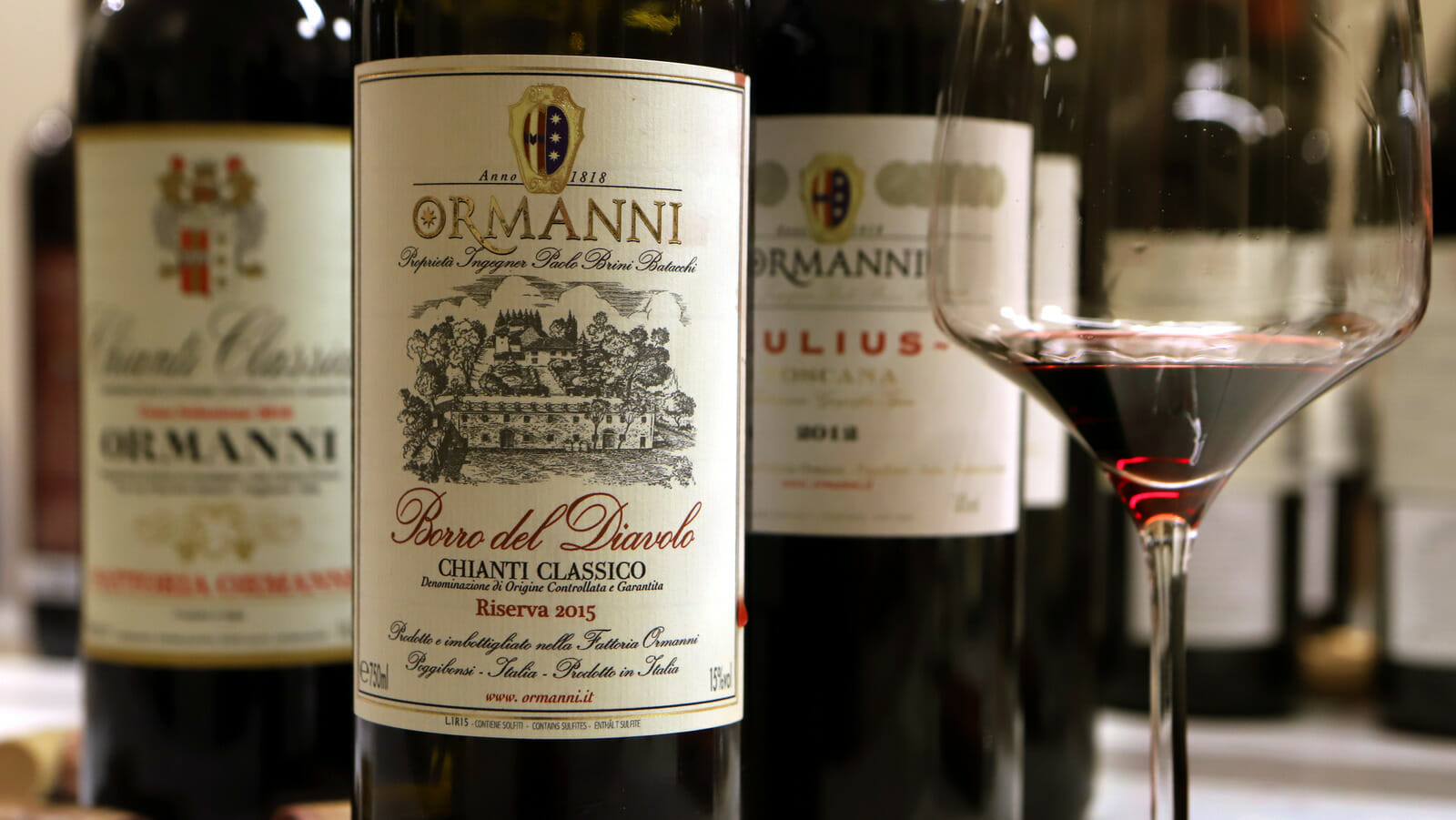 GANEI TIKVA, ISRAEL - MARCH 7: Bottles of Ormanni red wine are served at a tasting of imported Italian Tuscan wines on March 7, 2019 in Ganei Tikva in central Israel. The estate, which has vineyards in both the Chianti and Chianti Classico appellations, has a history dating back to 1200 and was mentioned by Dante Alighieri in his Divine Comedy "Paradise - Canto XVI". (Photo by David Silverman/Getty Images)